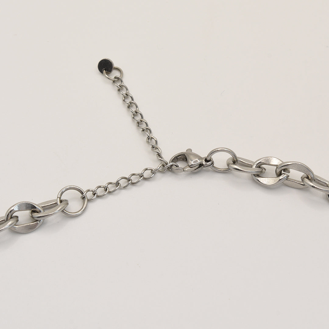 A close-up of the Salty Dreamers Necklace | Paua Shell Waka—featuring large, round silver links with an adjustable extension chain—elegantly displayed on a white background, perfect to pair with handmade New Zealand jewelry.
