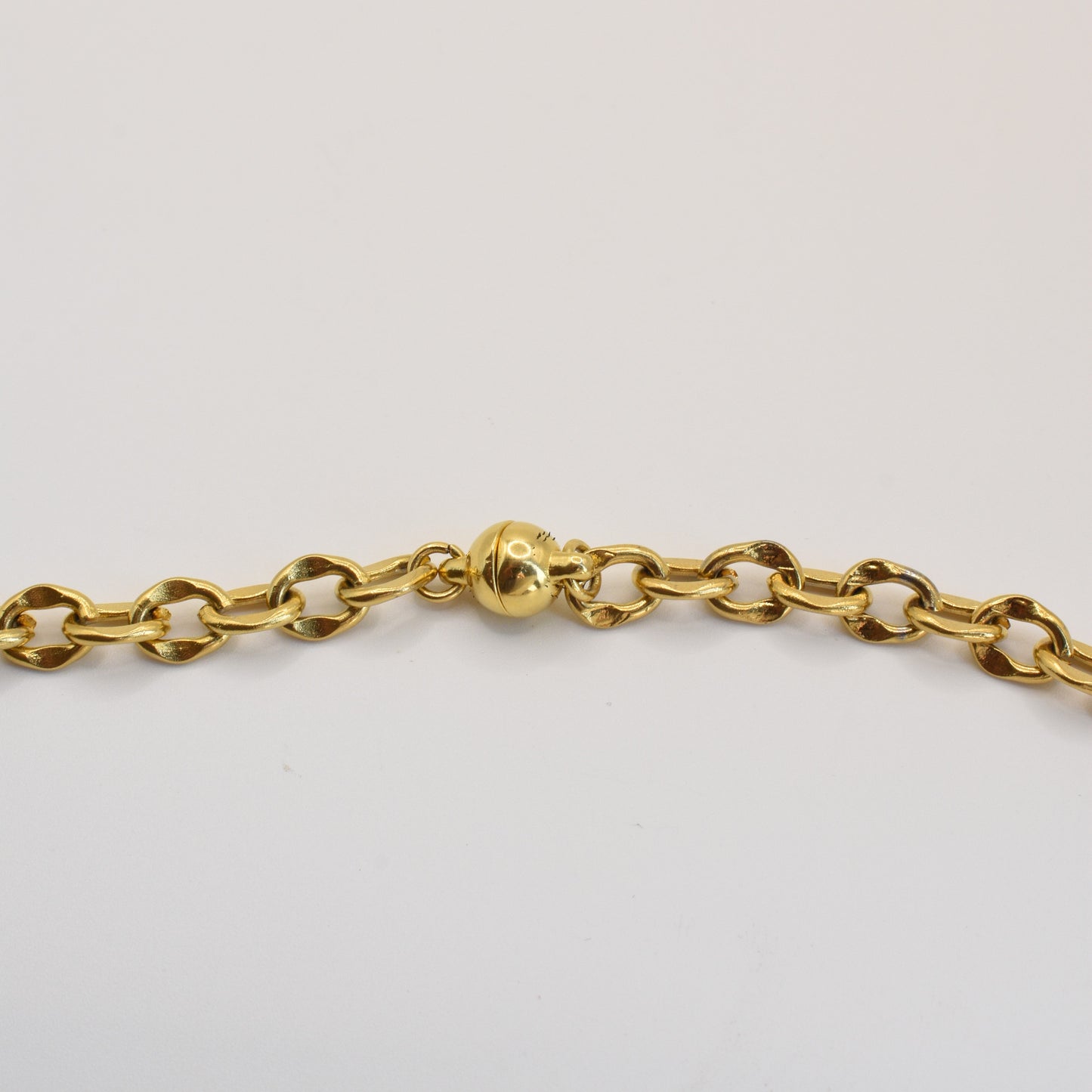 The Necklace | Ocean Dollar Gold by Salty Dreamers is a handmade gold chain with oval links and a round magnetic clasp, displayed on a white background.
