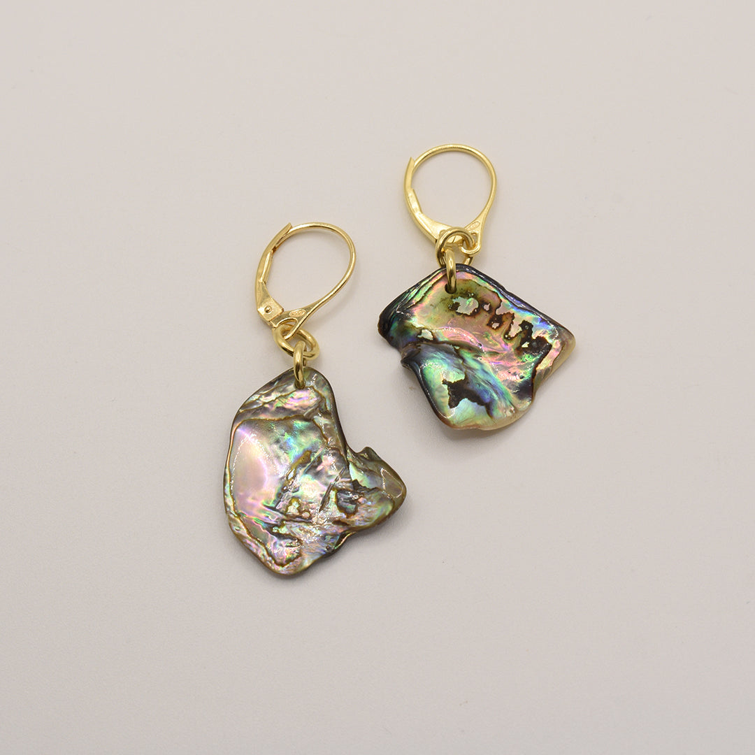The Salty Dreamers Earrings | Paua Shell Aroha are handmade gold plated silver earrings featuring iridescent stones, adding a touch of elegance to any look.