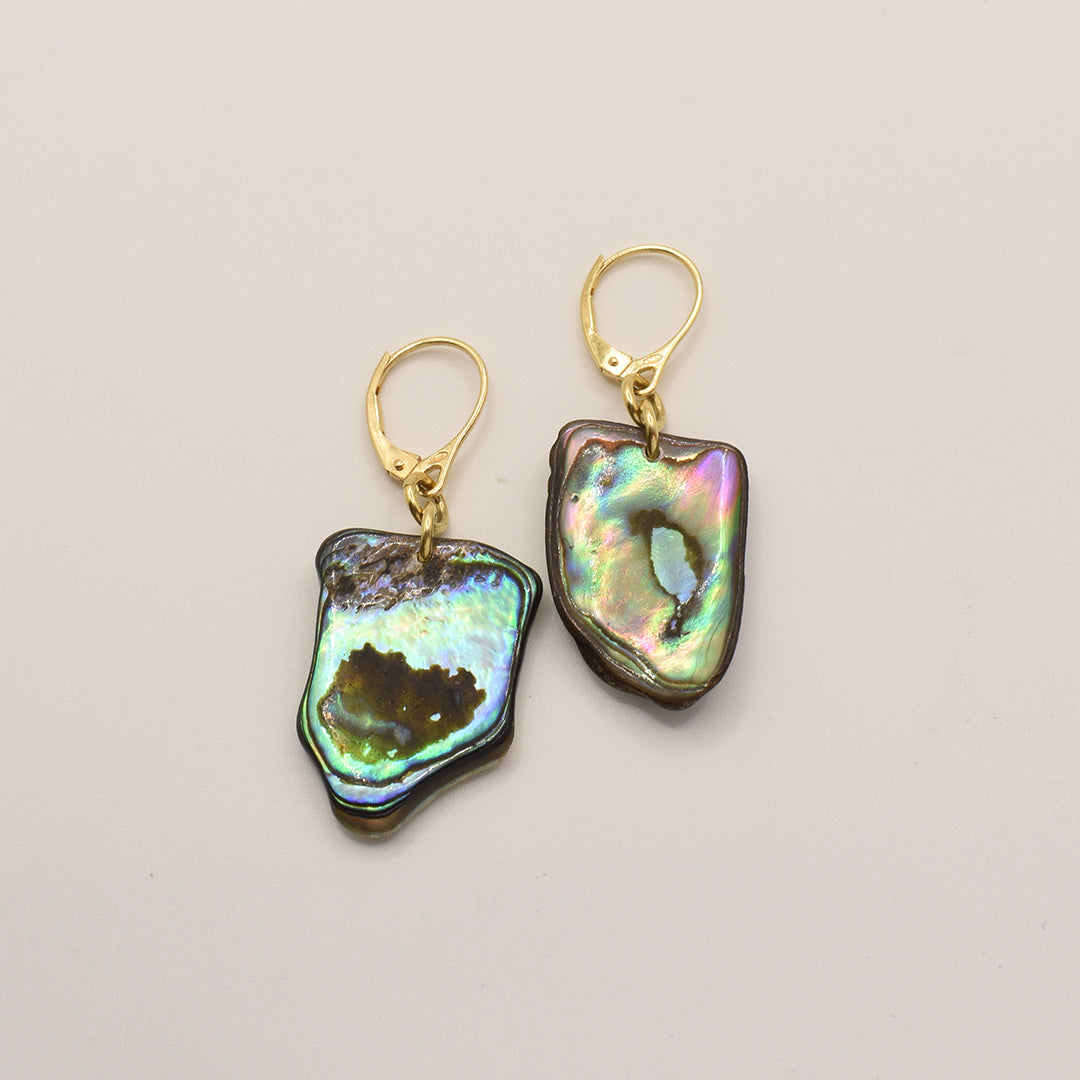 Salty Dreamers Earrings | Paua Shell Korohea feature handmade, iridescent pāua shell pieces with gold-plated 925-silver leverback hooks, shown on a plain light background.