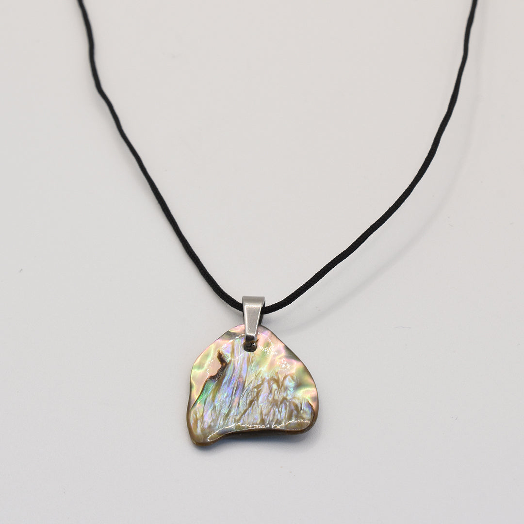 The Salty Dreamers Necklace | Paua Shell Whitau features a black nylon cord and an iridescent abalone shell pendant set in a silver bail—a stunning handmade ocean-inspired accessory.