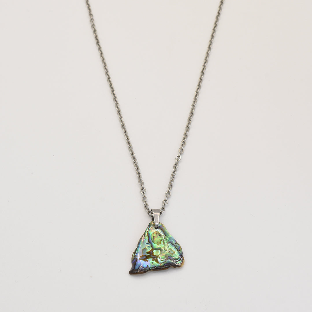 The Salty Dreamers Necklace | Paua Shell Ngaru is a handmade piece featuring a small, iridescent pāua shell pendant that shimmers beautifully.