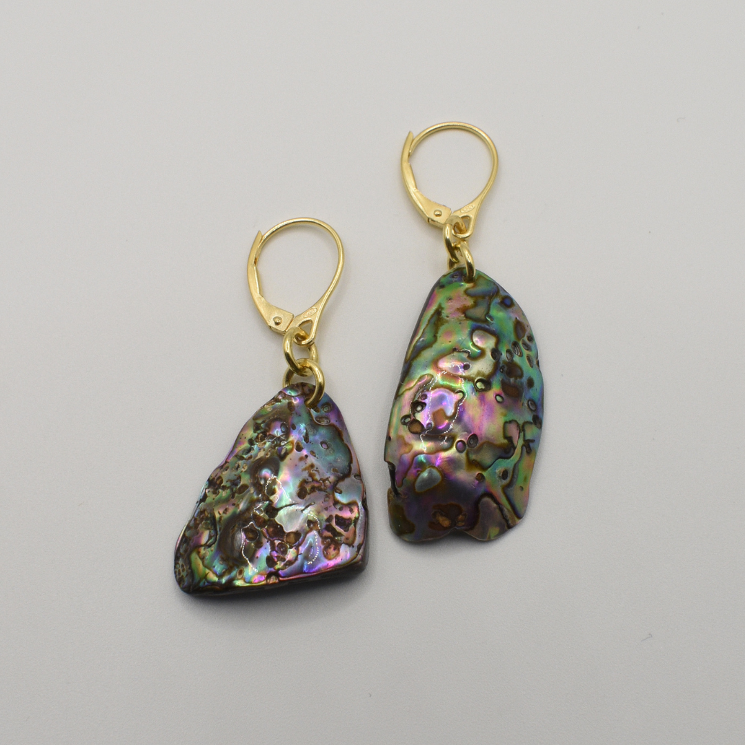 Salty Dreamers' Earrings | Paua Shell Korohea: handmade gold leverback earrings with iridescent pāua shell pieces in purple, green, and blue hues, shown on a plain white background.