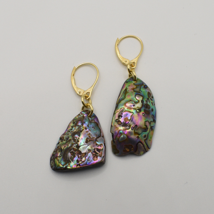 Salty Dreamers' Earrings | Paua Shell Korohea: handmade gold leverback earrings with iridescent pāua shell pieces in purple, green, and blue hues, shown on a plain white background.