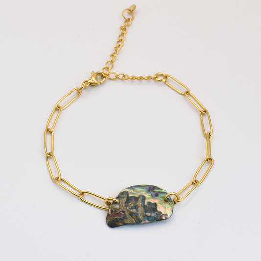 The Salty Dreamers Bracelet | Paua Shell Aroha showcases a handmade New Zealand gold chain with elongated links and a paua shell centerpiece, capturing abalone elegance. Shown on a white background.