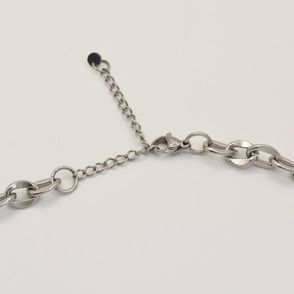 A close-up of the Salty Dreamers Necklace | Paua Shell Waka—featuring large, round silver links with an adjustable extension chain—elegantly displayed on a white background, perfect to pair with handmade New Zealand jewelry.