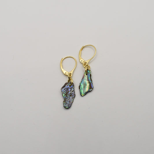 Salty Dreamers' Paua Shell Moana Earrings are handmade gold leverbacks featuring irregular iridescent abalone shell pendants, shown on a plain white background.