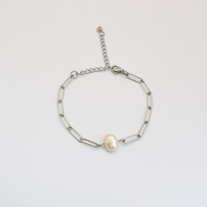The Bracelet | Paperclip Cutie Silver by Salty Dreamers features elongated silver links and a central freshwater pearl, shown against a plain white background.