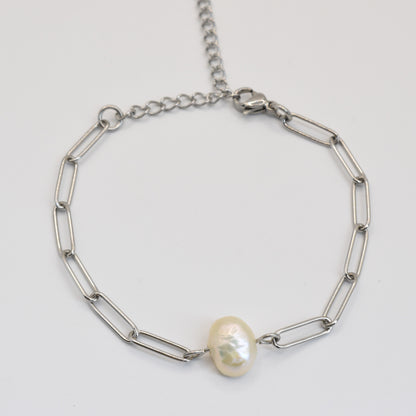 The Salty Dreamers Bracelet | Paperclip Cutie Silver features elongated silver links and a single freshwater pearl accent, elegantly handmade and shown on a plain white background.