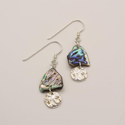 Salty Dreamers Earrings | Paua Shell Kekeno feature handmade iridescent New Zealand pāua shell and small round 925 silver charms, shown on a plain light background.