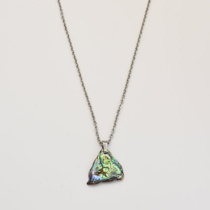 The Salty Dreamers Necklace | Paua Shell Ngaru is a handmade piece featuring a small, iridescent pāua shell pendant that shimmers beautifully.