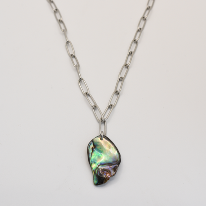 The Salty Dreamers Necklace | Paua Shell Tu features a handmade pāua shell abalone pendant on a bold silver chain, shown against a plain white background.