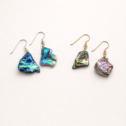 Add a splash of color to your style with Salty Dreamers' Earrings | Paua Shell Surprise—four 925 silver dangle earrings featuring unique, iridescent paua shell pendants in blue, green, and purple hues. Perfect for your jewellery bag!.