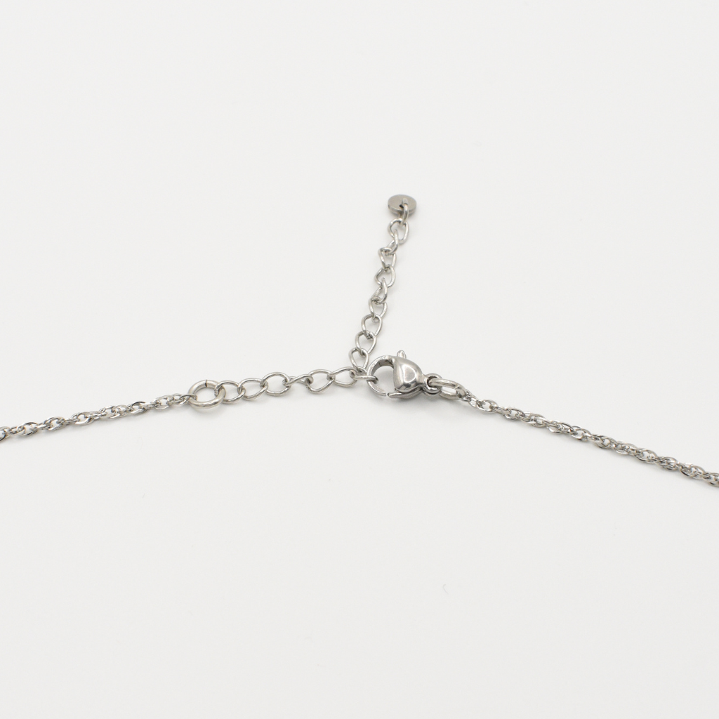 The Salty Dreamers "Necklace | Paua Shell Tu" is a handmade piece with a silver chain, adjustable extension, and lobster clasp closure, shown on a plain white background.